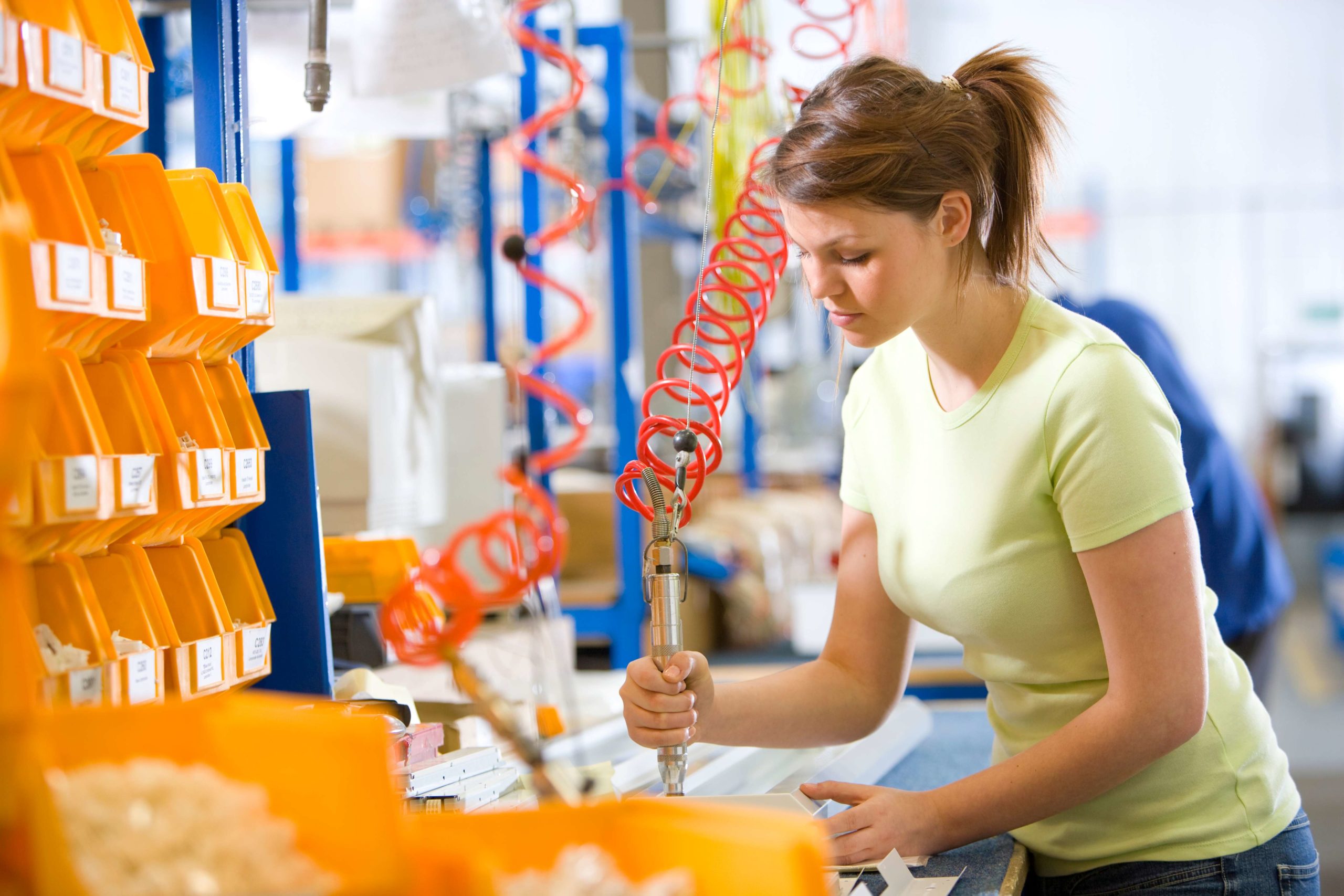 woman working in a medical device assembly plant