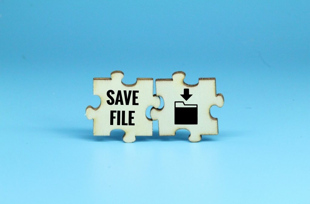 two puzzle pieces on a blue background - one says save file and the other is the save file icon