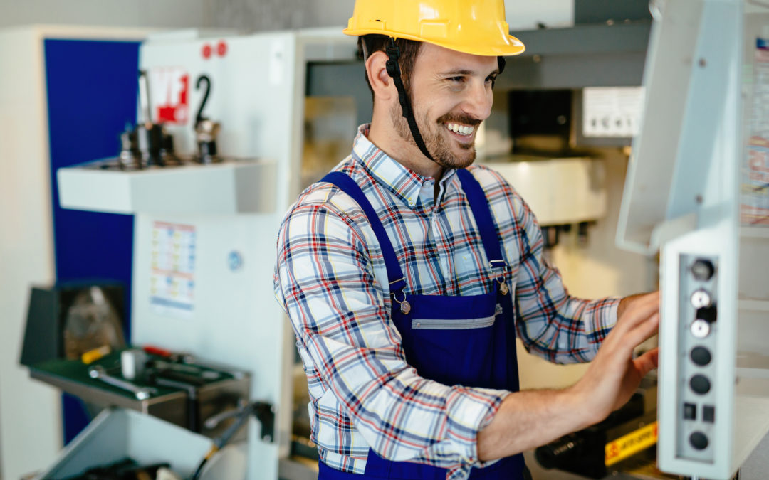 man in a manufacturing factory looking at digital work instructions