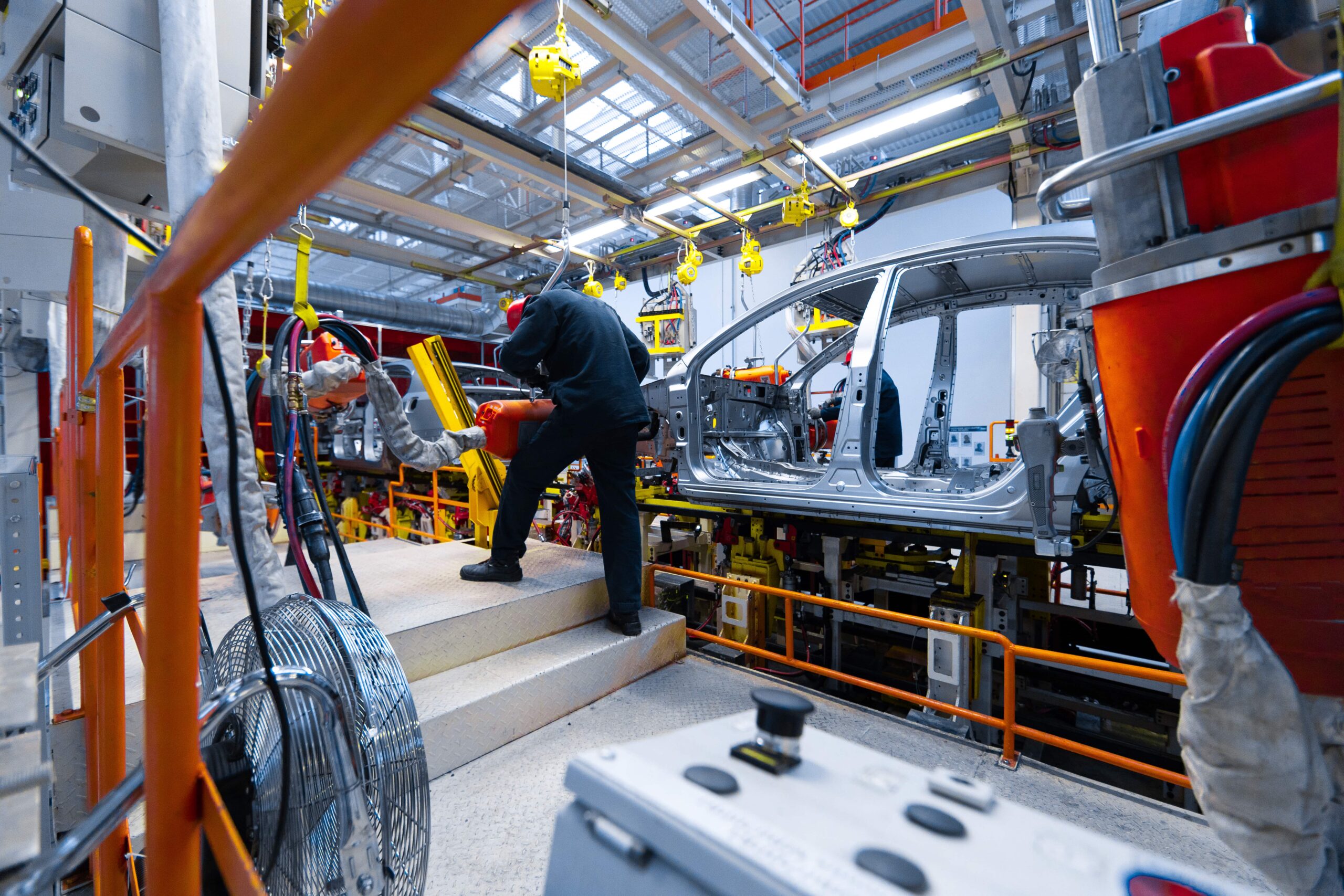 engineer-assemble-the-car-on-the-production-line-2025-02-13-02-00-11-utc-min engineer working on an assembly line in an automotive plant